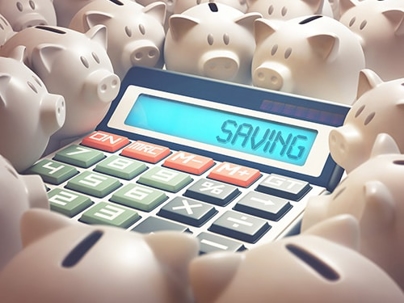 A calculator surrounded by piggie banks